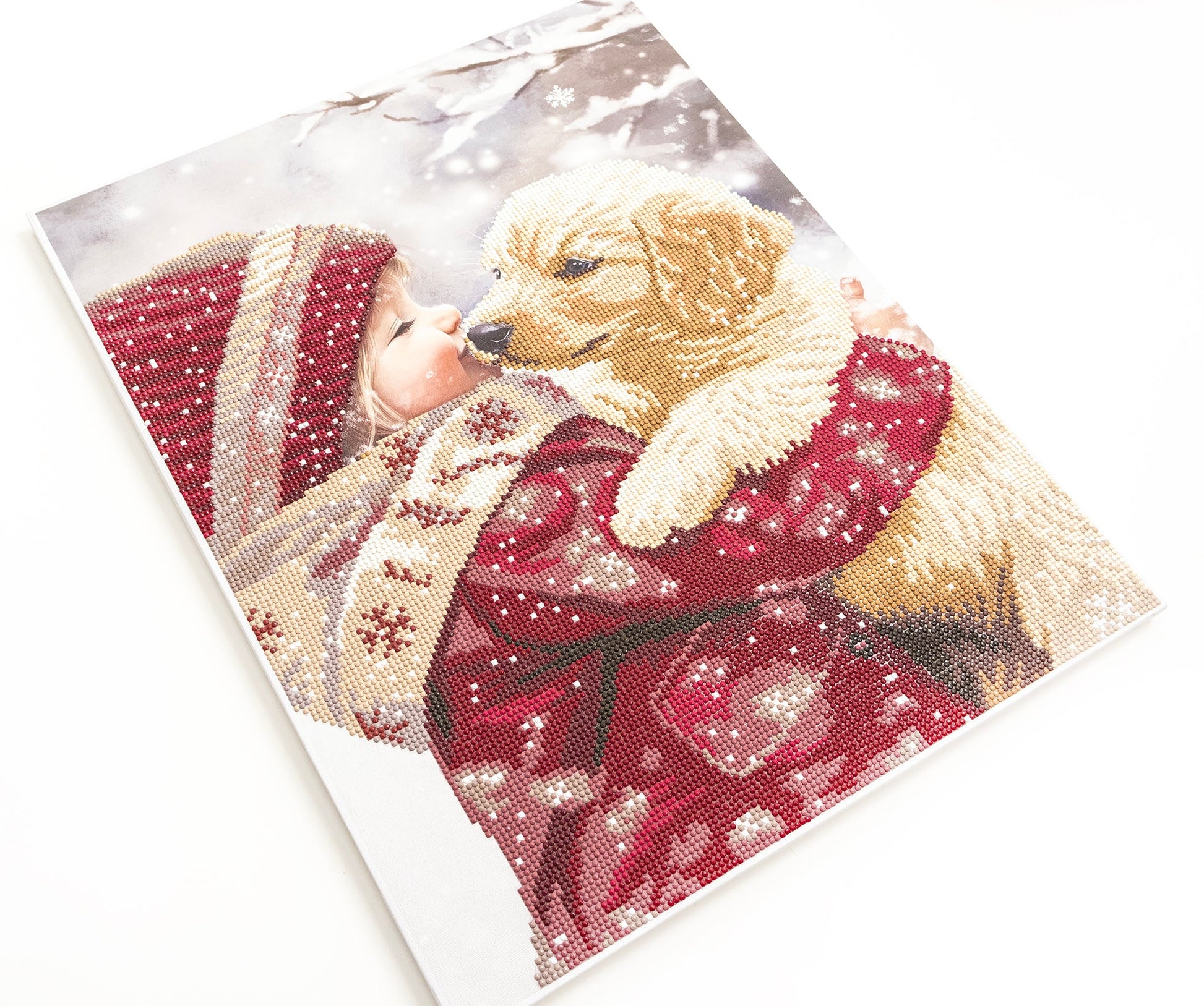 Card with a dog wearing a red sweater in a snowy scene