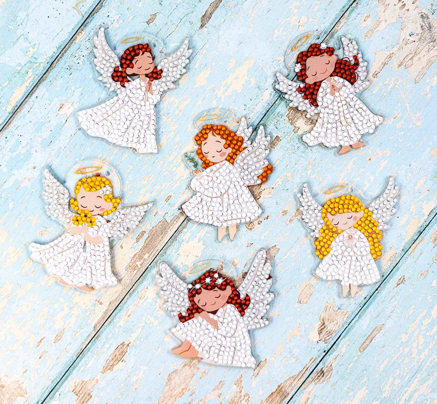 Crystal art Set of decorative angel figurines on a acrylic surface