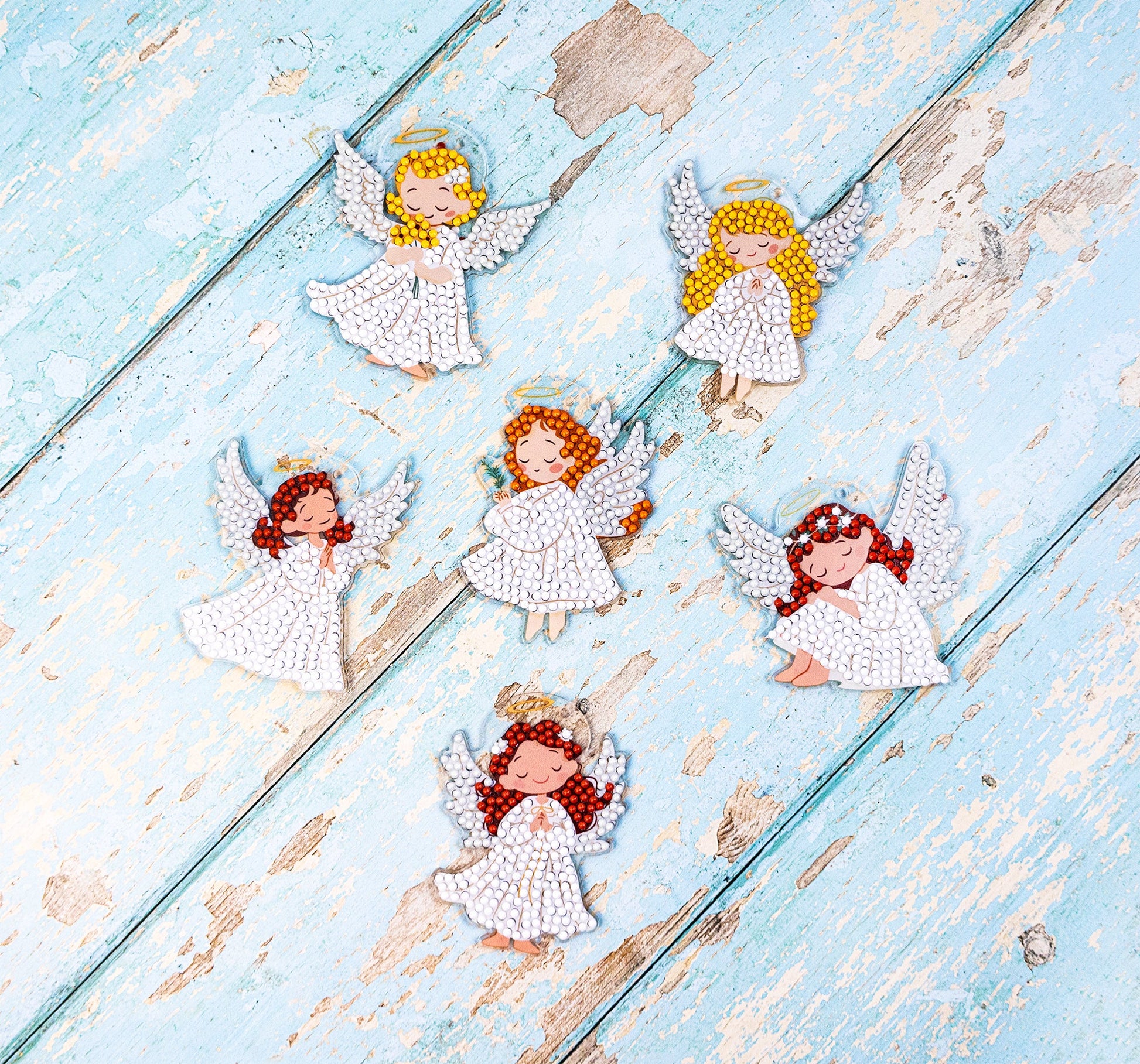 Diamond Dots Diamond Art kit Decorative angel figurines on a textured blue surface