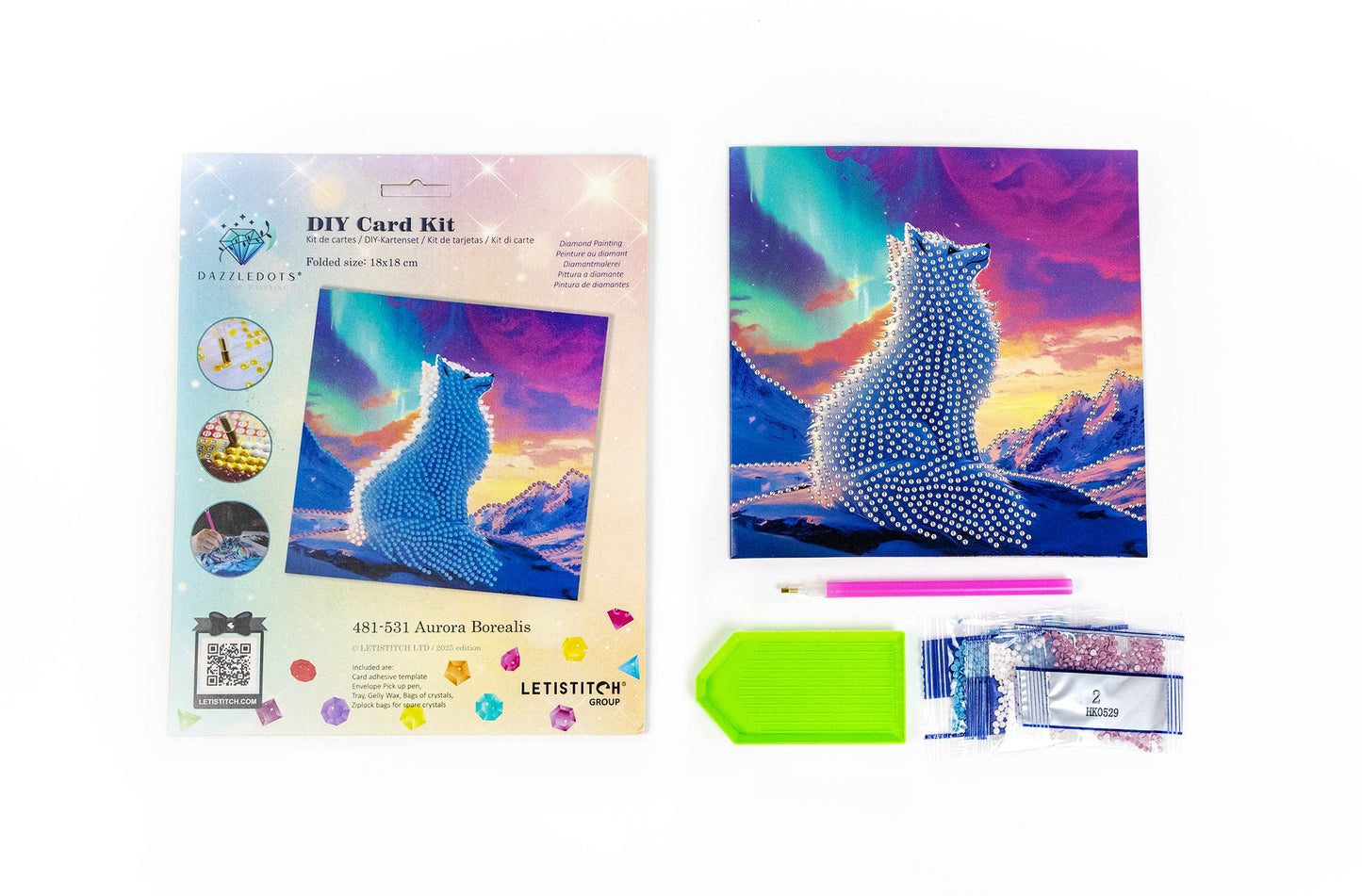 DIY card kit with wolf design and supplies on a white background