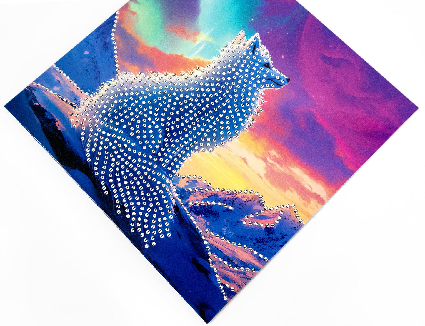 White fox design made of rhinestones against a colorful abstract background