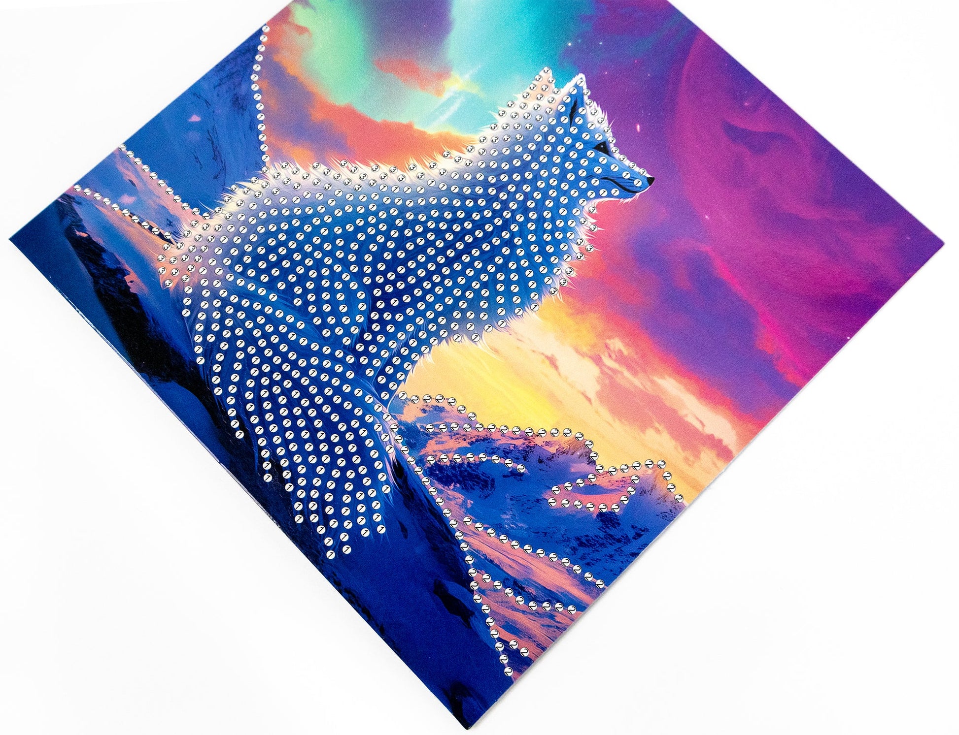 White fox design made of rhinestones against a colorful abstract background