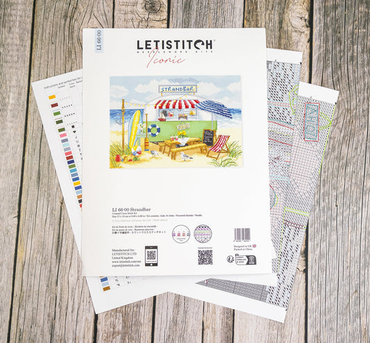Letistitch embroidery design sheet on a wooden surface