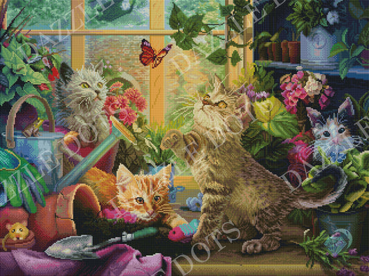 Diamond art club kit of kittens playing with flowers and a butterfly in a garden setting.