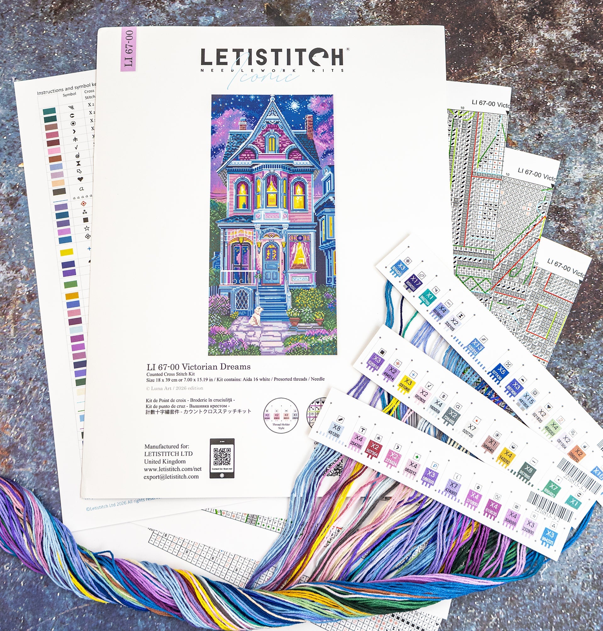 Letistitch embroidery kit with pattern sheets and colorful threads on a textured surface