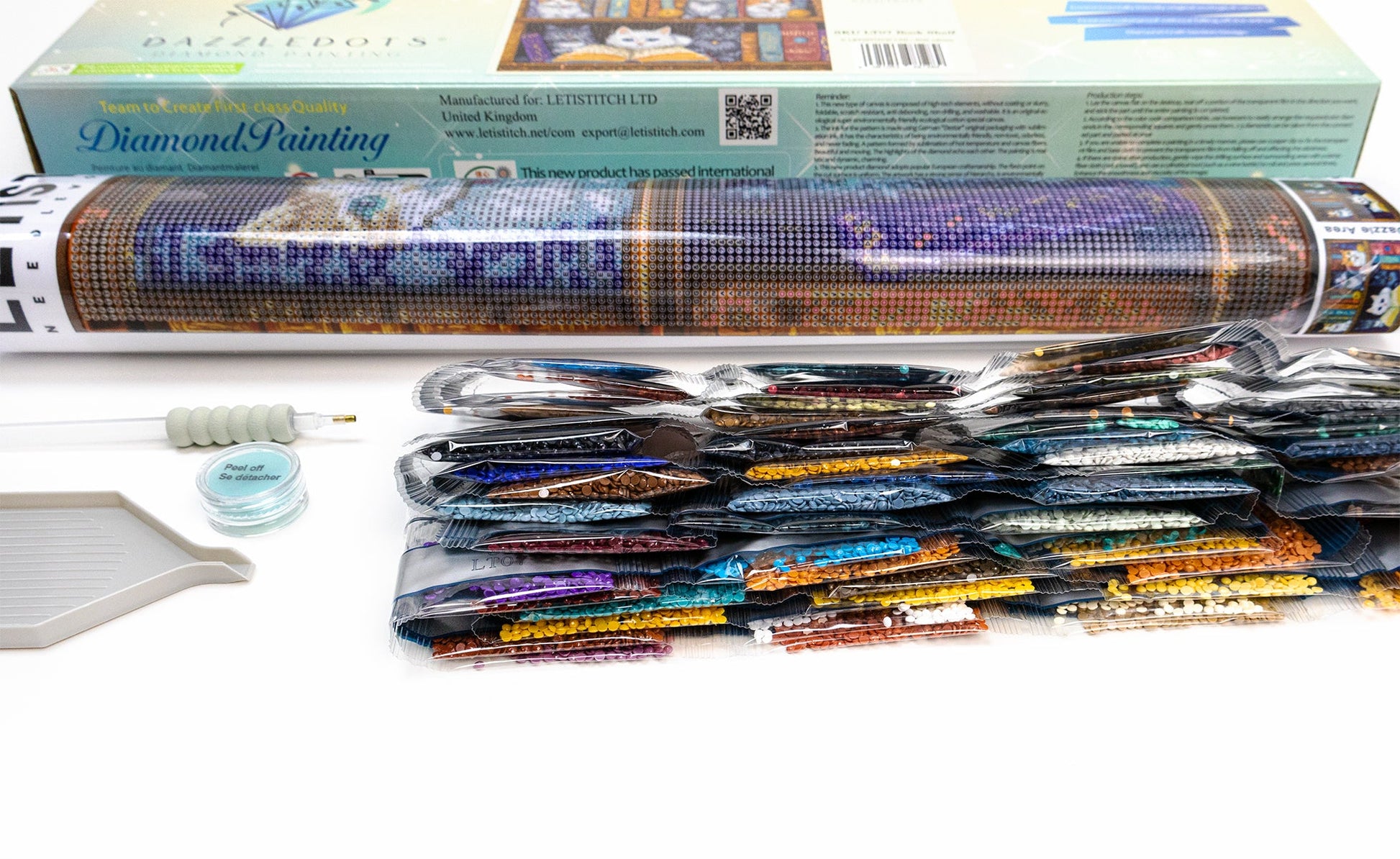 Diamond painting kit with materials on a white surface